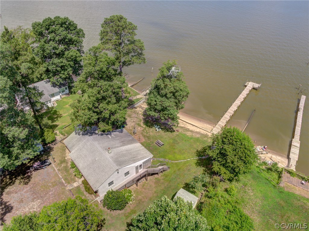 528 Old Mill Point Road Laneview, VA 22504 - Photo 9 of 30 an aerial view of a house with a yard and a lot of flower plants