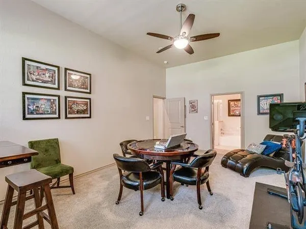 a view of a livingroom with furniture and a flat screen tv