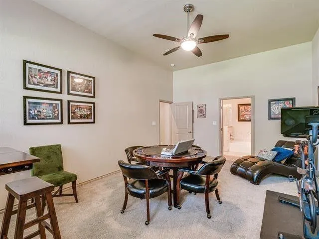 a view of a livingroom with furniture and a flat screen tv