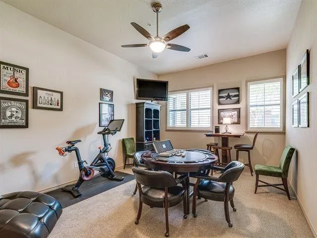 a view of a dining room with furniture and window