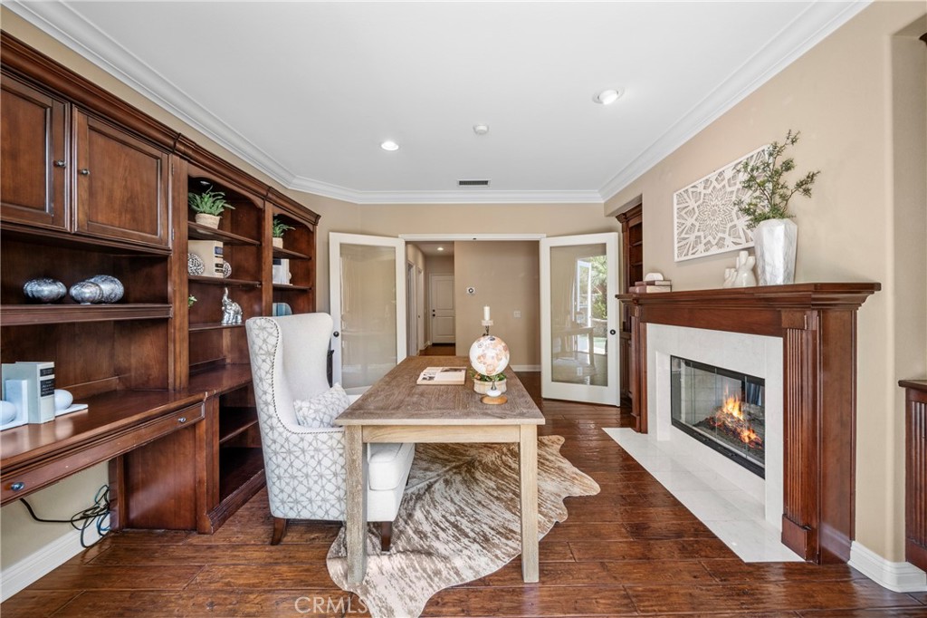 2241 Redwood Drive Glendora, CA 91741 - Photo 12 of 68 a living room with furniture a fireplace and wall paintings