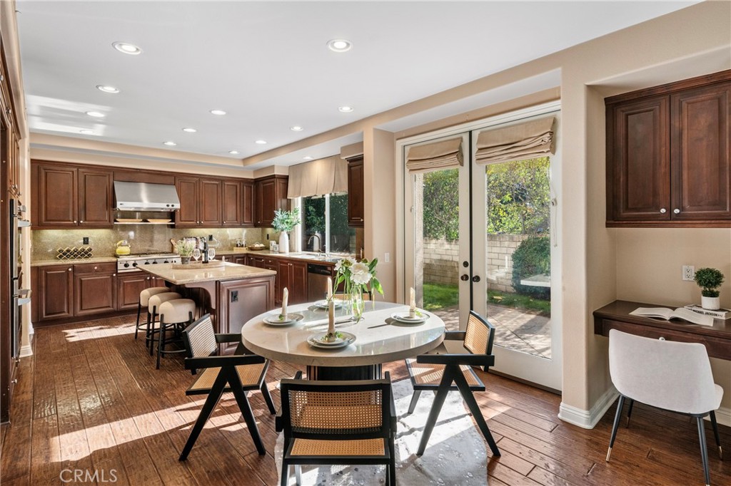 2241 Redwood Drive Glendora, CA 91741 - Photo 18 of 68 a kitchen with a dining table chairs and refrigerator