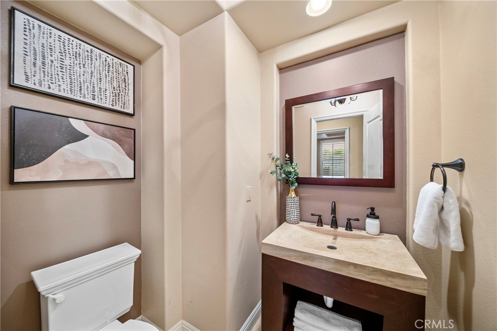 2241 Redwood Drive Glendora, CA 91741 - Photo 22 of 68 a bathroom with a toilet a sink and a mirror