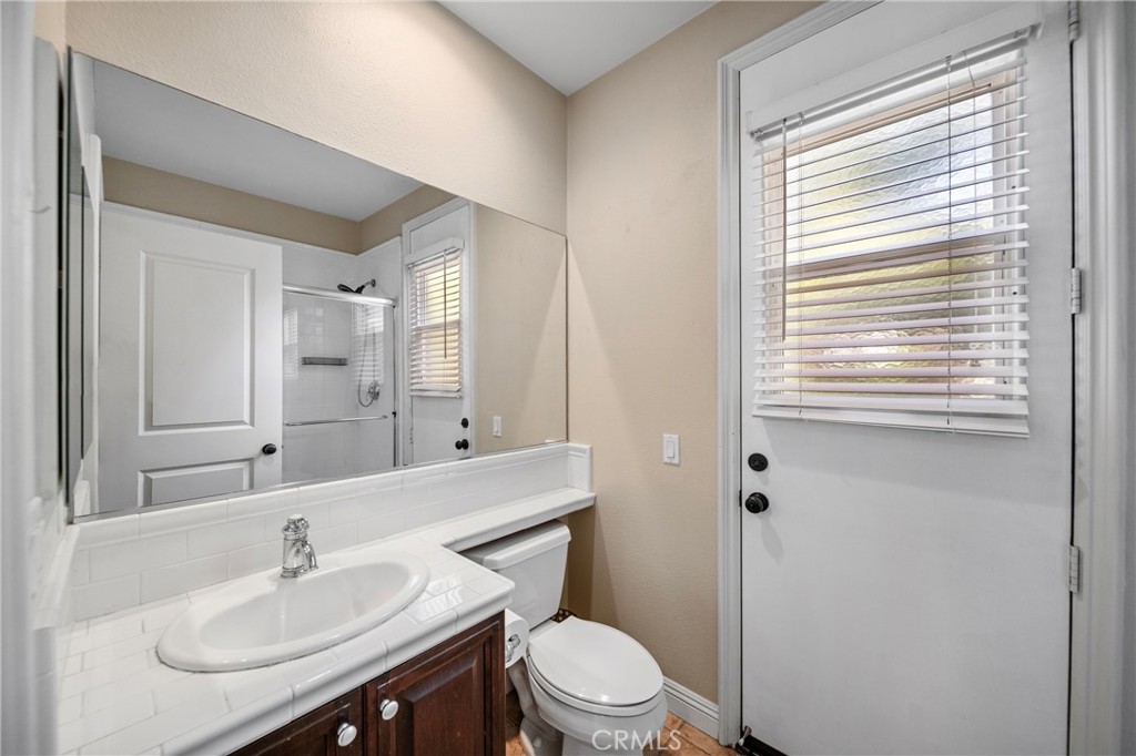 2241 Redwood Drive Glendora, CA 91741 - Photo 24 of 68 a bathroom with a sink toilet and a mirror