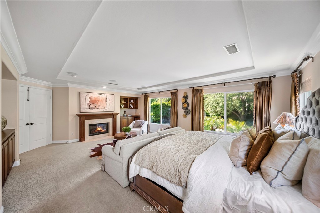 2241 Redwood Drive Glendora, CA 91741 - Photo 27 of 68 a large bedroom with a bed and a fireplace