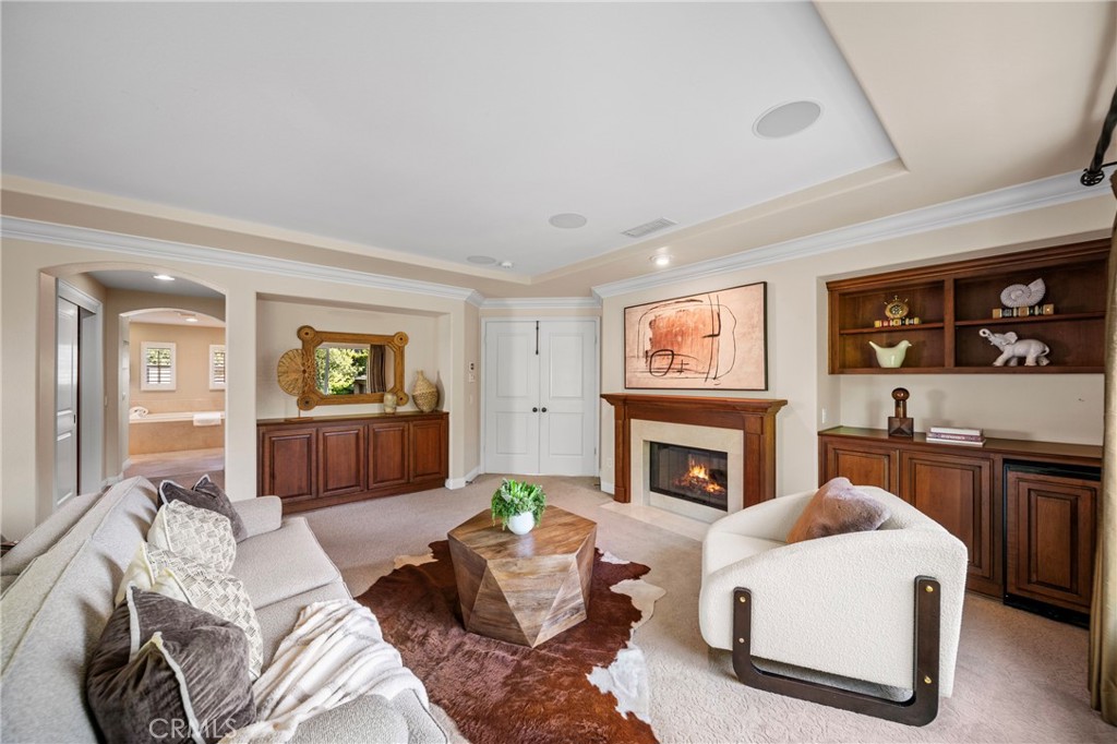 2241 Redwood Drive Glendora, CA 91741 - Photo 28 of 68 a living room with furniture a fireplace and a flat screen tv