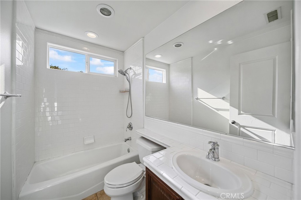 2241 Redwood Drive Glendora, CA 91741 - Photo 36 of 68 a bathroom with a bathtub shower sink vanity mirror and toilet