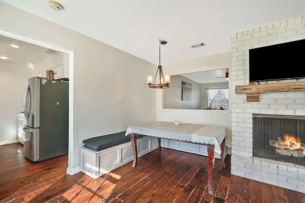 a living room with furniture fireplace and flat screen tv