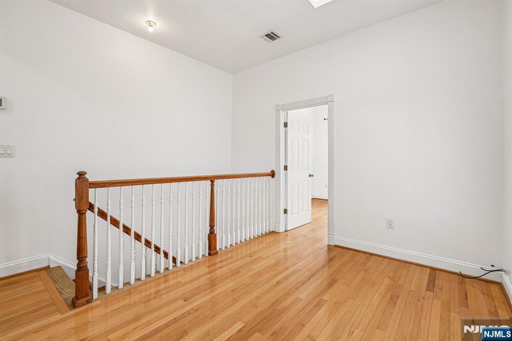 90 A Hackensack Plank Road Weehawken, NJ 07086 - Photo 22 of 40 a view of a hallway with wooden floor