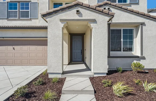 a front view of a house with a rug