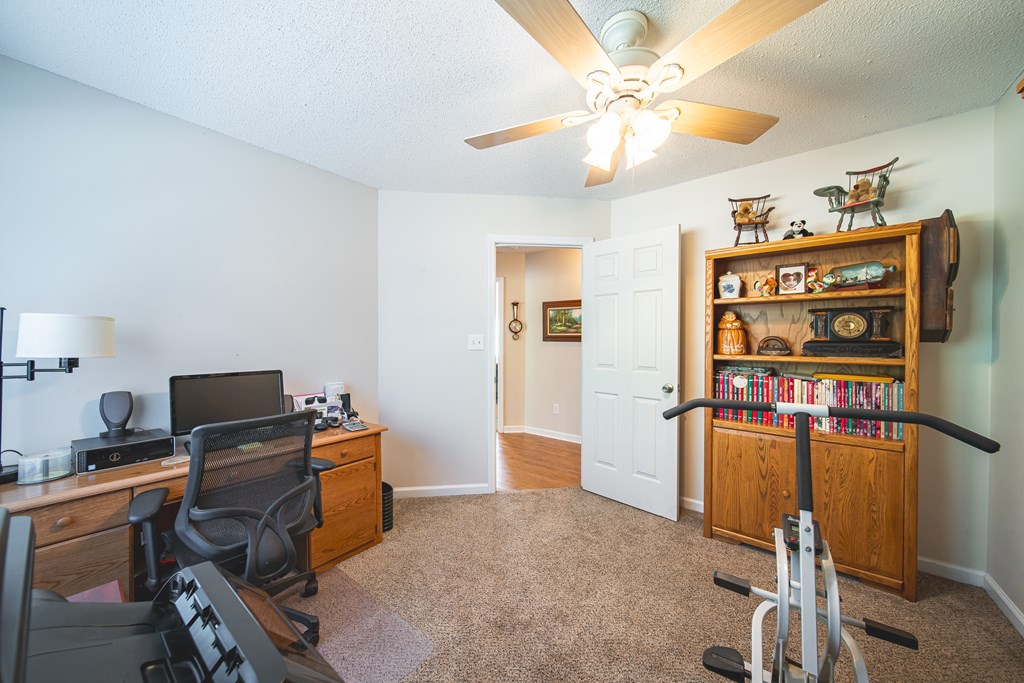 200 Lake Amah Lee Road Hampton, GA 30228 - Photo 18 of 29 a view of a workspace with furniture and a window
