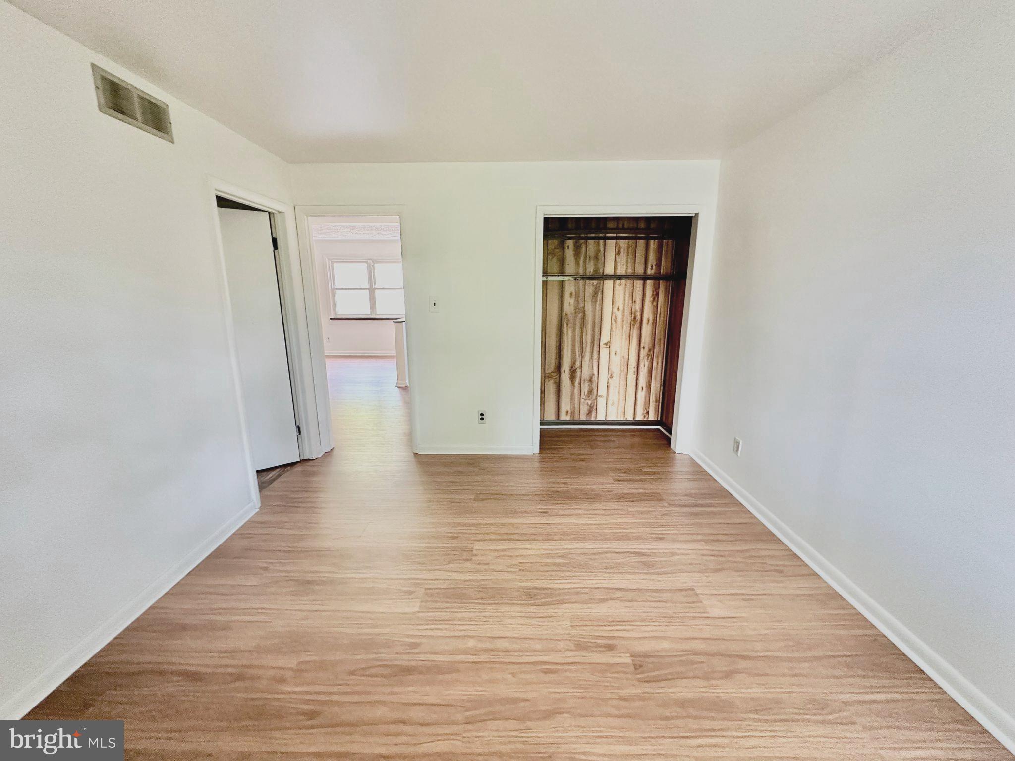 110 East 40th Street, Unit 2 Wilmington, DE 19802 - Photo 2 of 7 a view of an empty room with wooden floor and closet