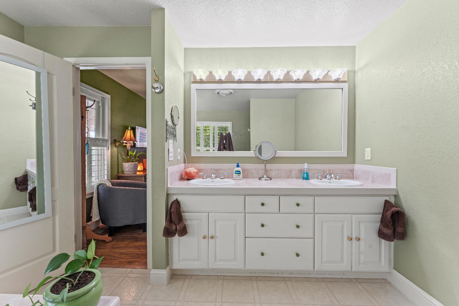19699 McCourtney Road Grass Valley, CA 95949 - Photo 5 of 27 a bathroom with a sink a light fixture and a mirror