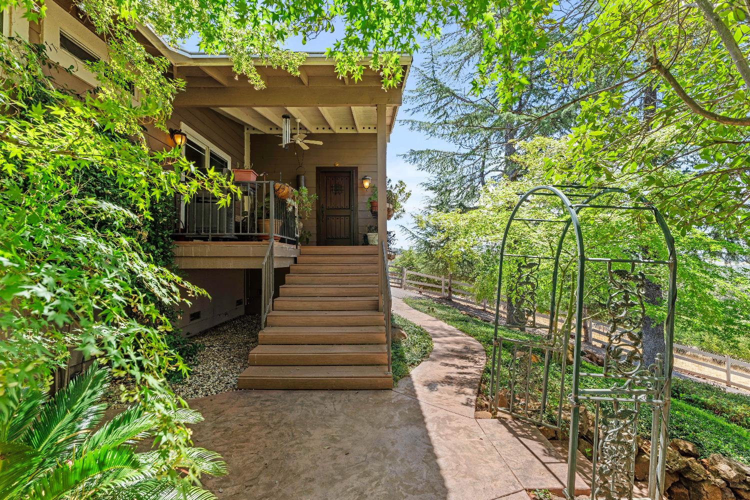 19699 McCourtney Road Grass Valley, CA 95949 - Photo 7 of 27 a view of house with stairs and flowers