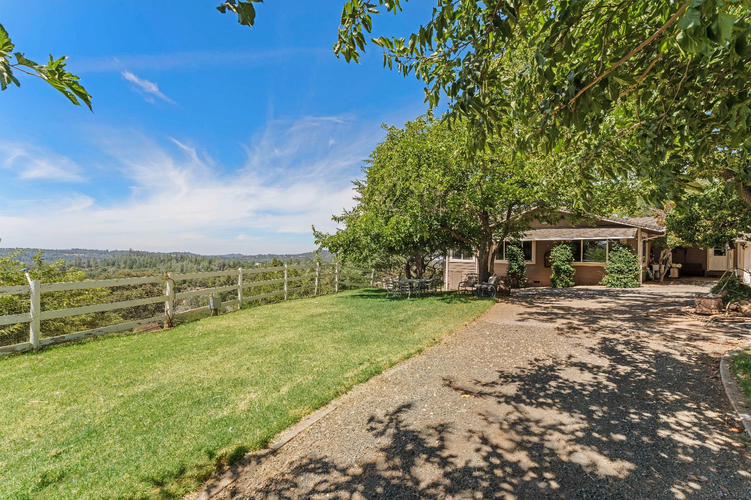 19699 McCourtney Road Grass Valley, CA 95949 - Photo 15 of 27 a view of a house with a yard