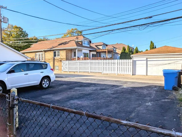 a view of a car parked in front of a house