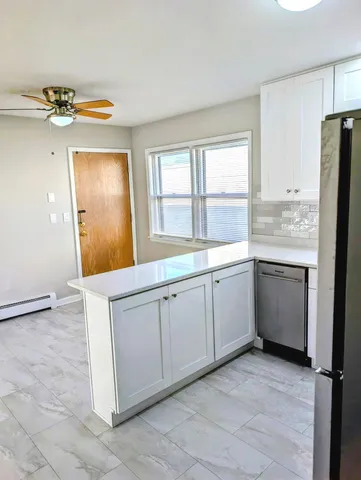 a view of a kitchen with a sink