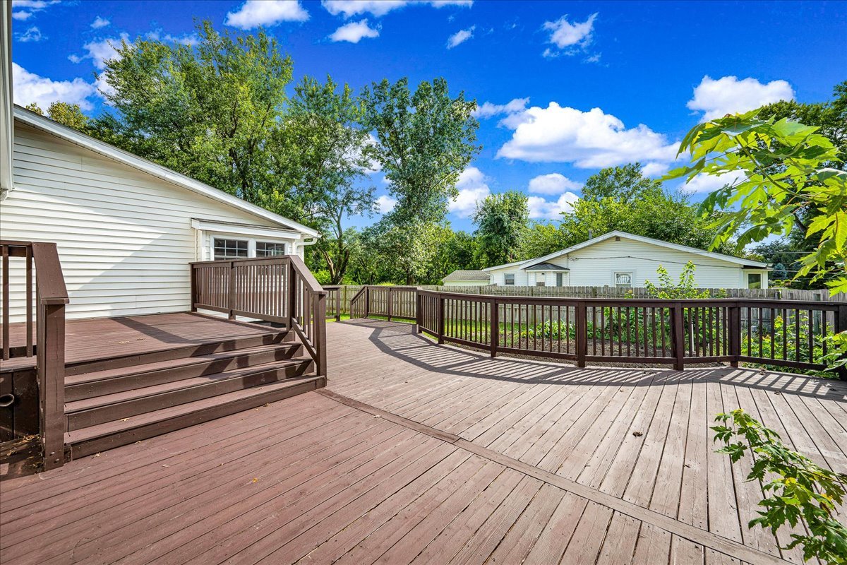 116 Lakeview Road East Galesburg, IL 61430 - Photo 27 of 36 a view of a wooden deck with a yard