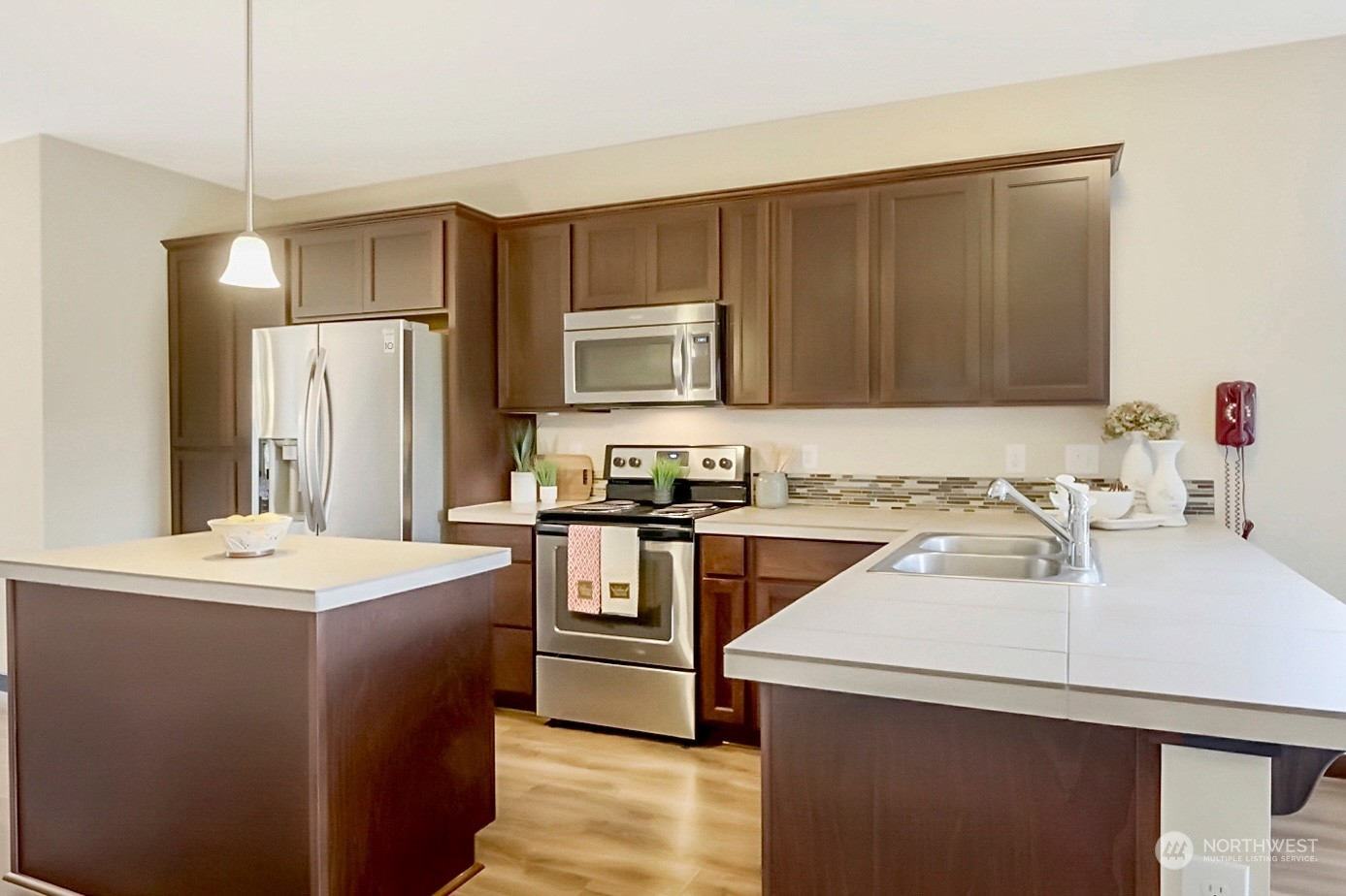 7100 Shinkle Place Southwest Seattle, WA 98106 - Photo 15 of 40 a kitchen with a sink a stove a refrigerator and a oven