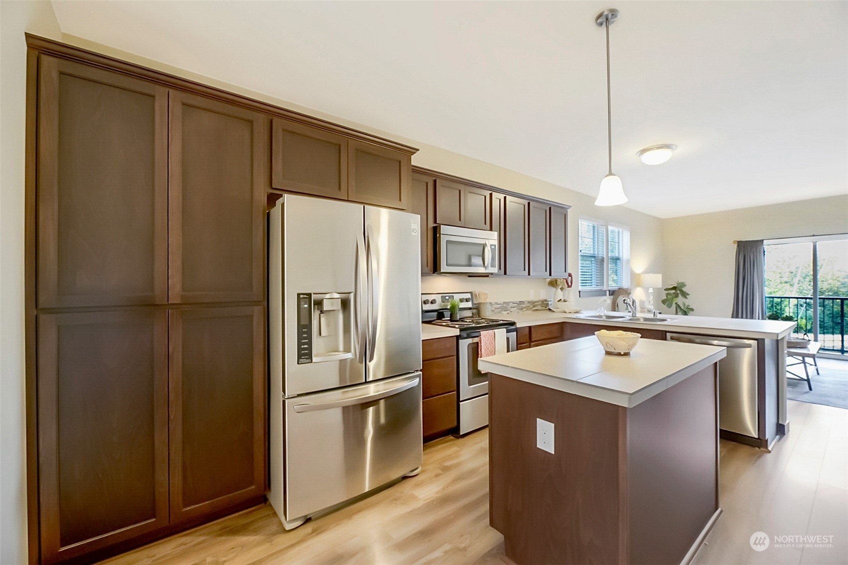 7100 Shinkle Place Southwest Seattle, WA 98106 - Photo 16 of 40 a kitchen with a refrigerator a sink and a stove