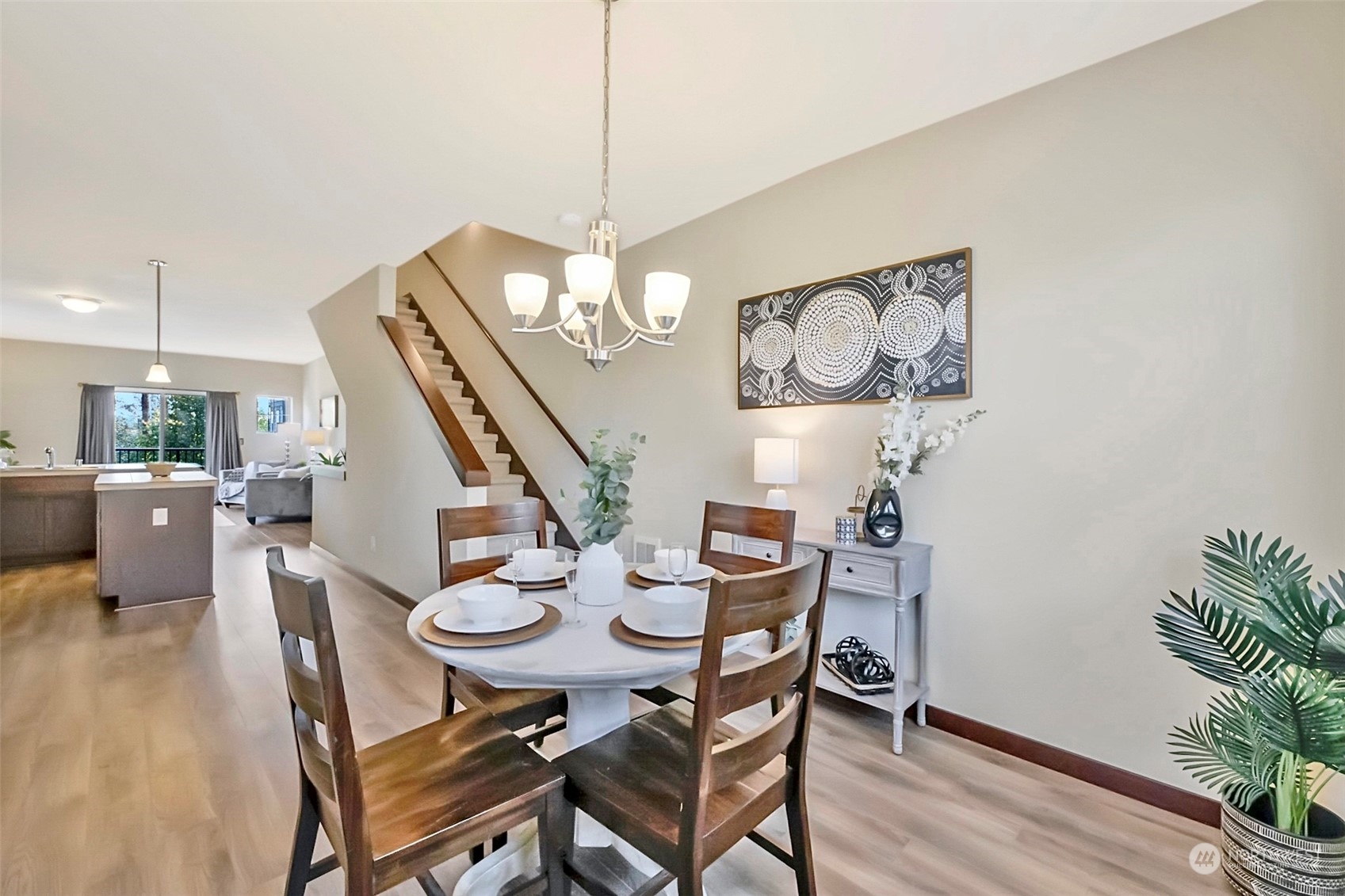 7100 Shinkle Place Southwest Seattle, WA 98106 - Photo 22 of 40 a view of a dining room with furniture wooden floor and chandelier