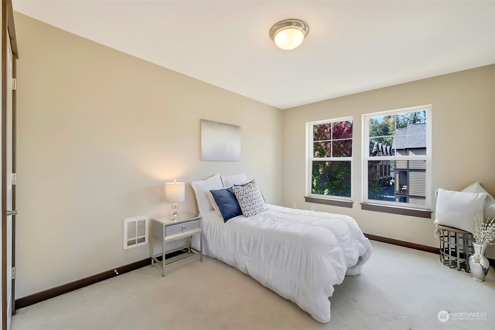 7100 Shinkle Place Southwest Seattle, WA 98106 - Photo 27 of 40 a bedroom with bed and a large window