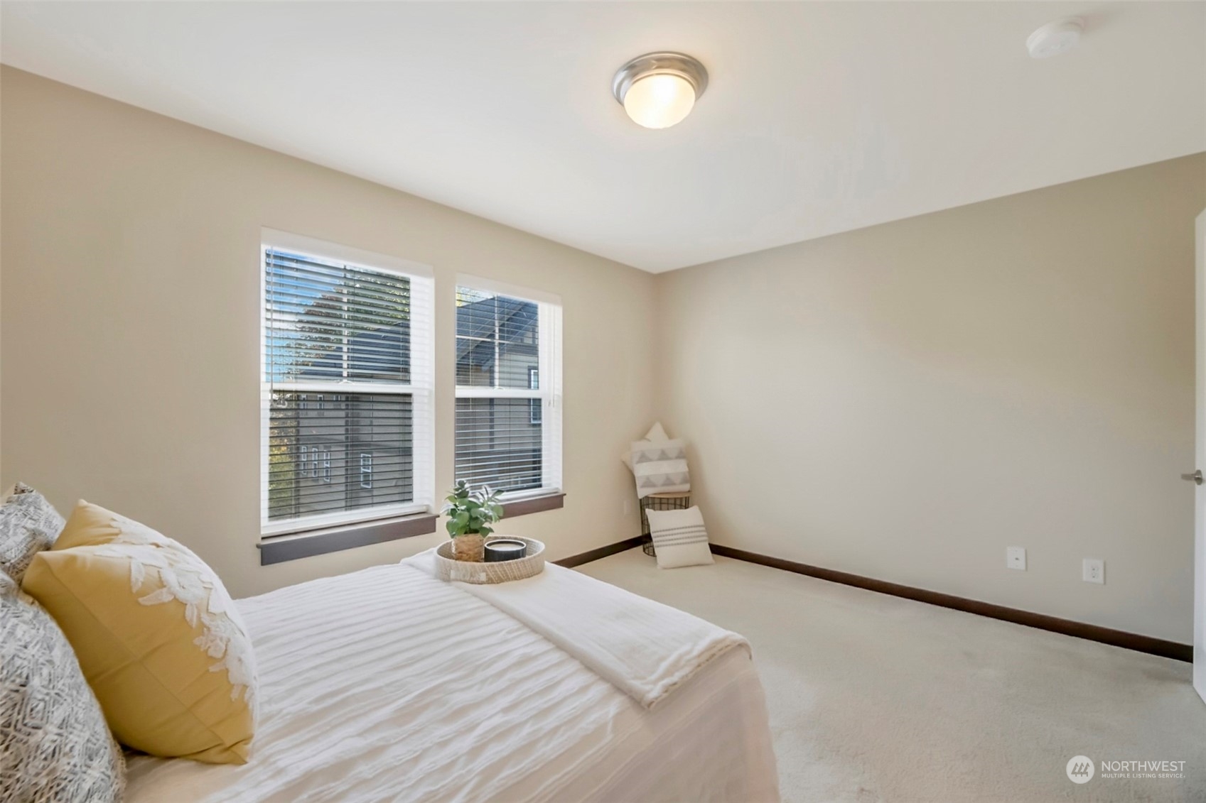 7100 Shinkle Place Southwest Seattle, WA 98106 - Photo 30 of 40 a view of a bedroom with a bed and wooden floor