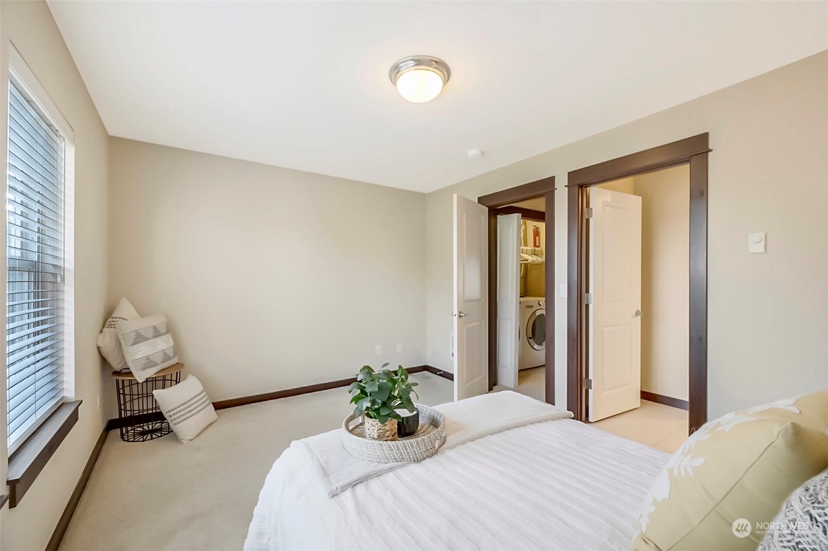 7100 Shinkle Place Southwest Seattle, WA 98106 - Photo 32 of 40 a bedroom with a bed and window