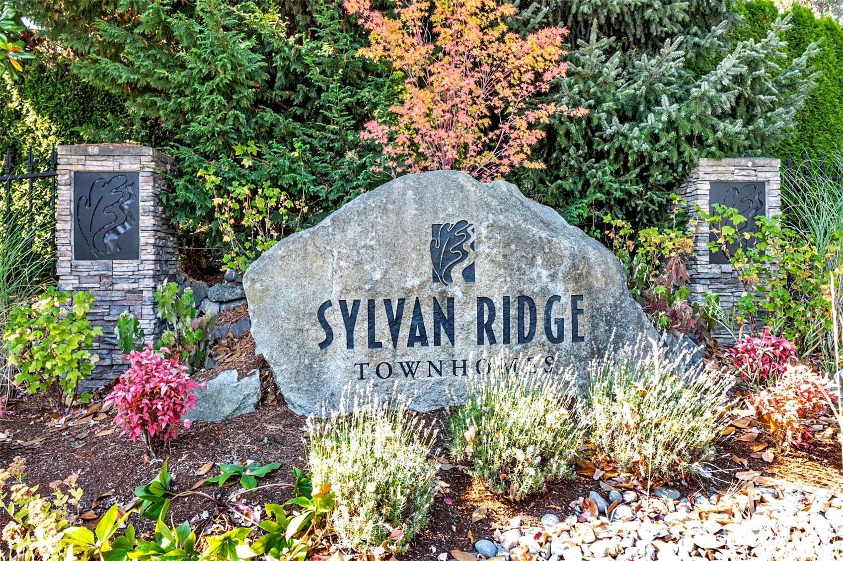 7100 Shinkle Place Southwest Seattle, WA 98106 - Photo 40 of 40 a view of a sign board with flower plants