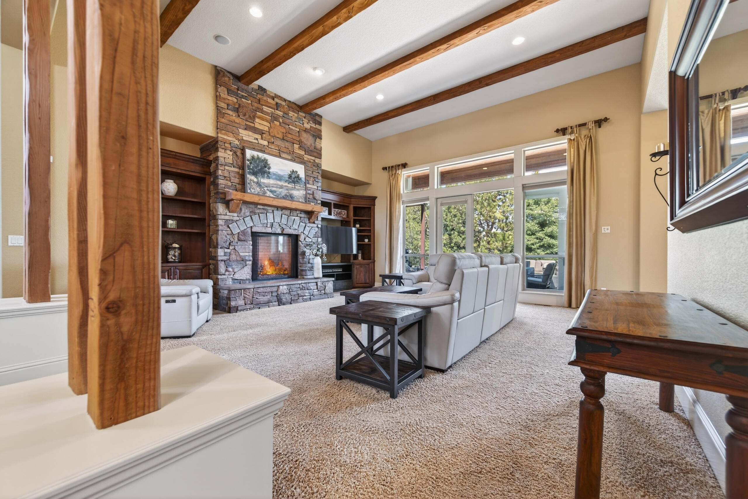 9009 Merlin Drive Redmond, OR 97756 - Photo 12 of 98 a living room with fireplace furniture and a large window