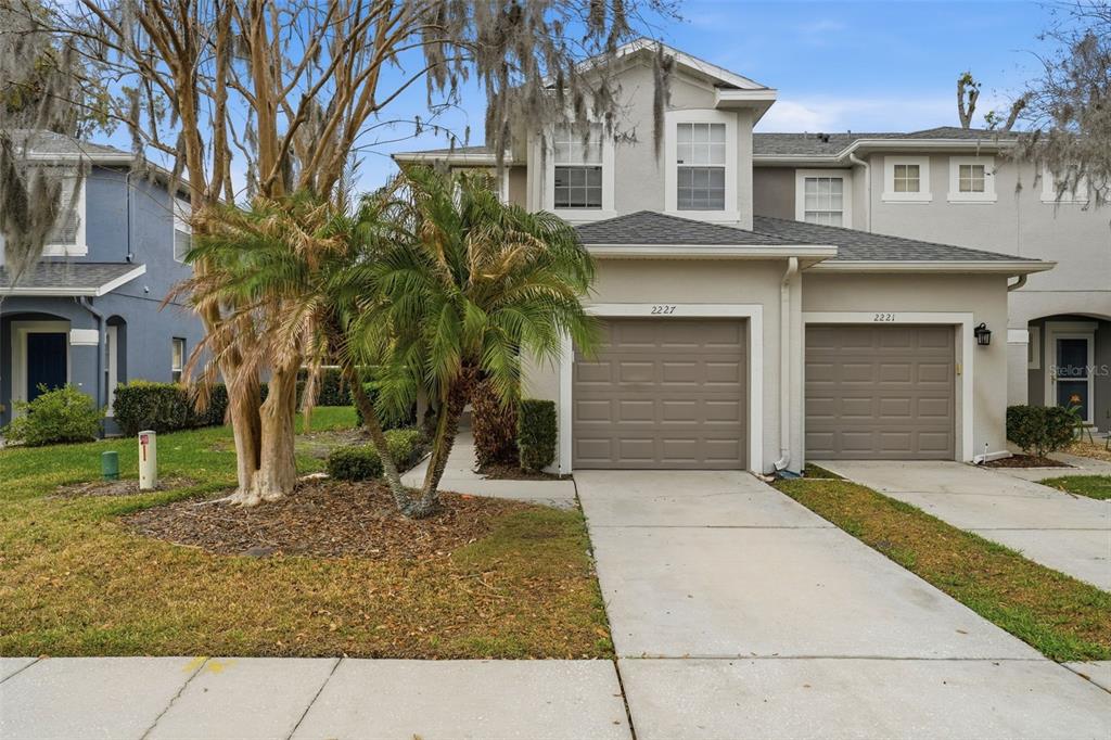 2227 Brancaster Circle Ocoee, FL 34761 - Photo 1 of 30 a front view of a house with garden