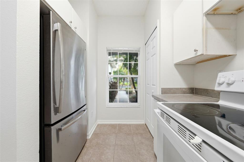2227 Brancaster Circle Ocoee, FL 34761 - Photo 11 of 30 a view of a kitchen with a refrigerator and a sink
