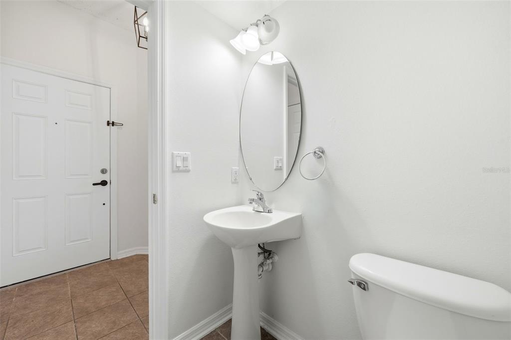 2227 Brancaster Circle Ocoee, FL 34761 - Photo 15 of 30 a bathroom with a sink a toilet and a mirror