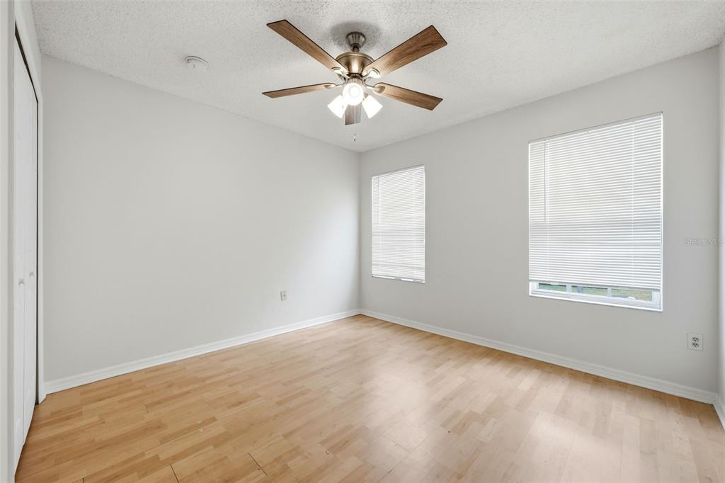 2227 Brancaster Circle Ocoee, FL 34761 - Photo 23 of 30 an empty room with wooden floor and windows