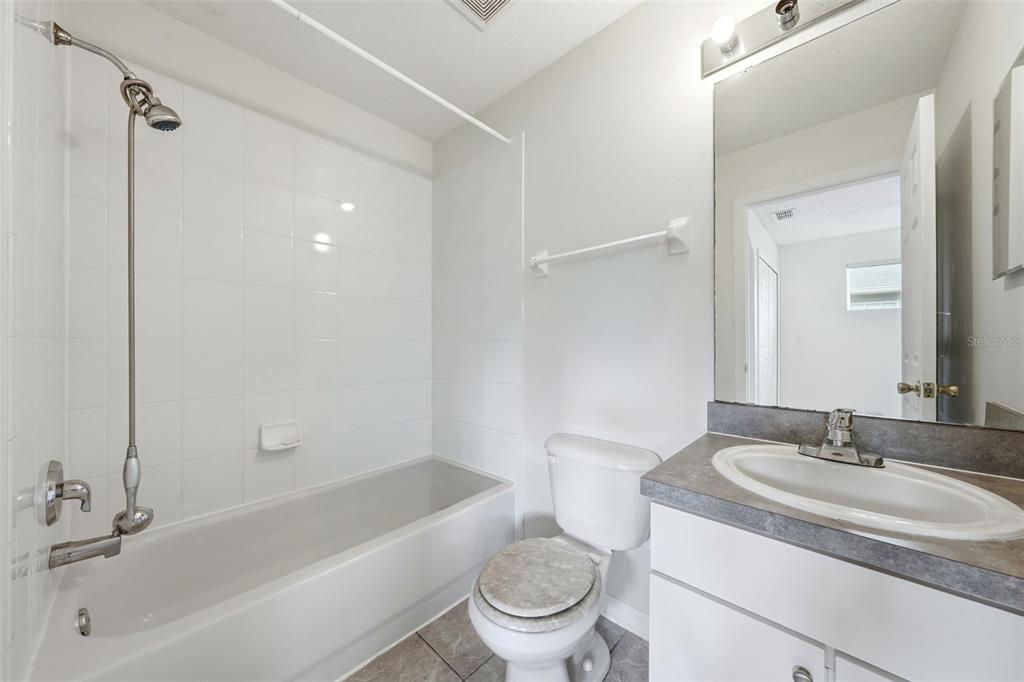 2227 Brancaster Circle Ocoee, FL 34761 - Photo 25 of 30 a bathroom with a sink toilet and shower