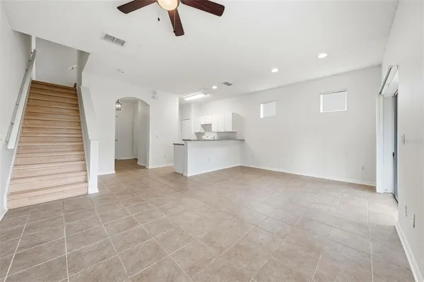 a view of a kitchen with a sink and cabinets