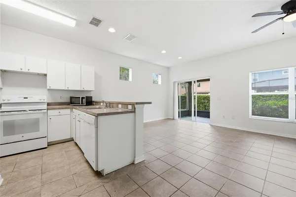 a kitchen with a stove a sink and a refrigerator