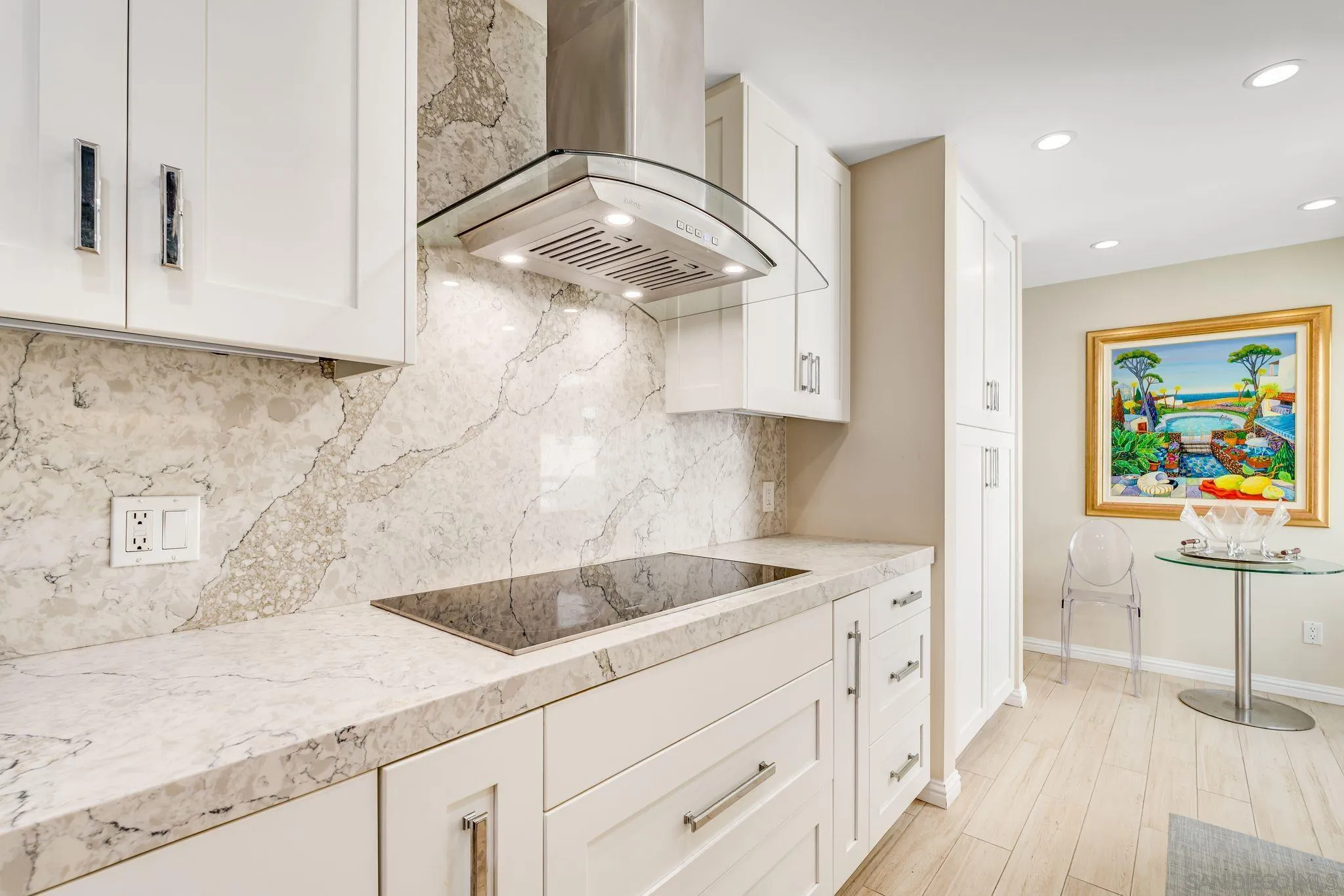 100 Coast Boulevard, Unit 302 La Jolla, CA 92037 - Photo 1 of 21 a kitchen with a sink and cabinets