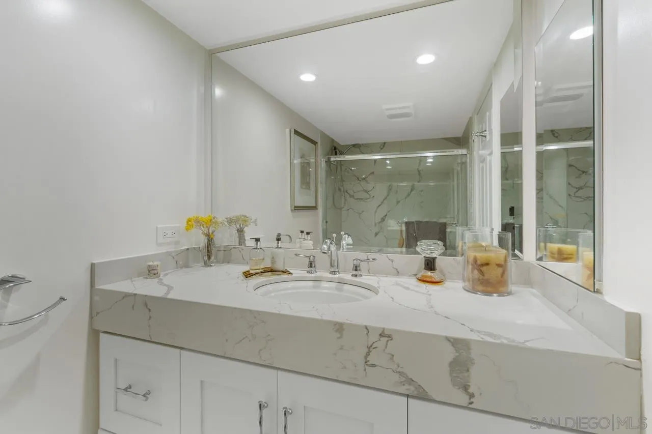 100 Coast Boulevard, Unit 302 La Jolla, CA 92037 - Photo 13 of 21 a bathroom with a sink double vanity and a mirror