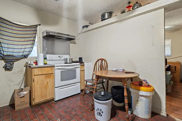 a utility room with sink dryer and washer