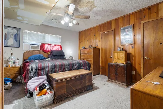 a living room with a couch and a chandelier