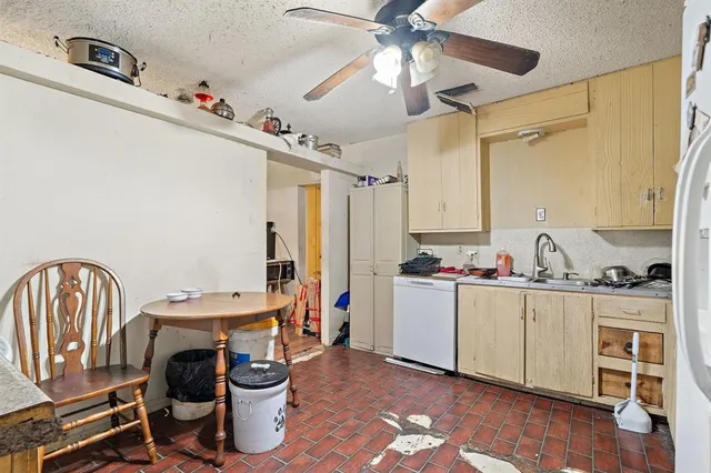 a room with a chair and a chandelier