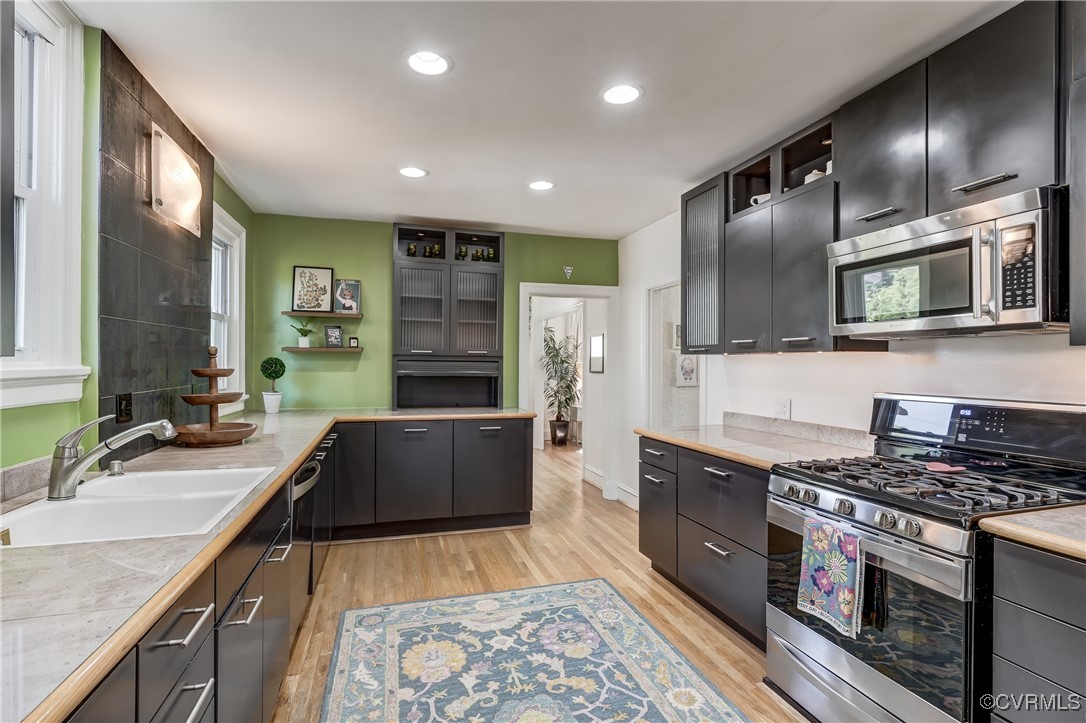 3906 Brook Road Richmond, VA 23227 - Photo 16 of 50 a large kitchen with stainless steel appliances granite countertop a sink stove and refrigerator