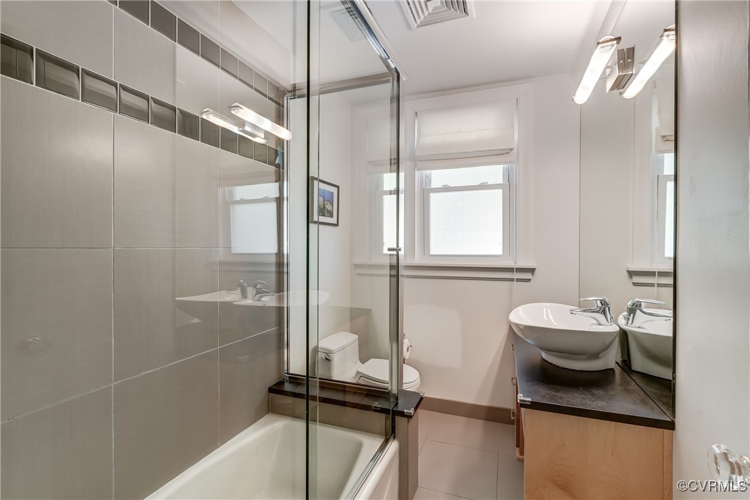 3906 Brook Road Richmond, VA 23227 - Photo 29 of 50 a bathroom with a sink a toilet and shower