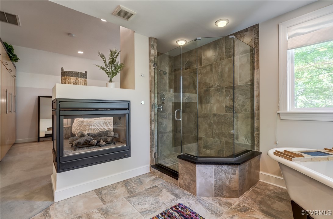 3906 Brook Road Richmond, VA 23227 - Photo 39 of 50 a bathroom with a bathtub a shower and a sink