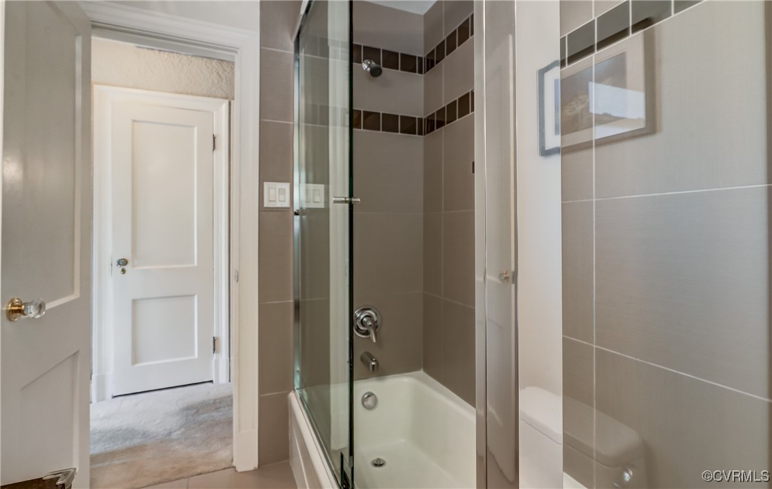 3906 Brook Road Richmond, VA 23227 - Photo 42 of 50 a bathroom with a glass shower door