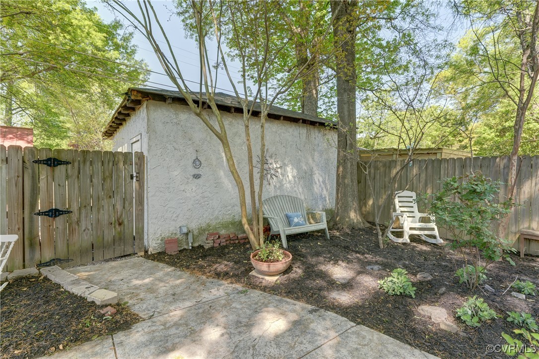 3906 Brook Road Richmond, VA 23227 - Photo 44 of 50 a backyard of a house with table and chairs