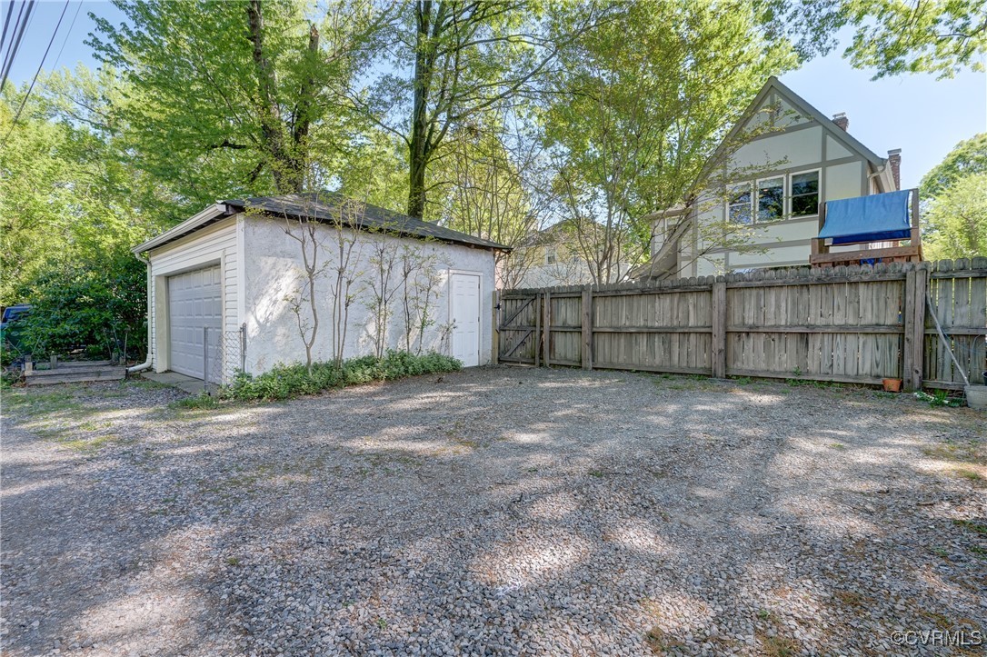 3906 Brook Road Richmond, VA 23227 - Photo 49 of 50 a view of backyard of house with wooden fence
