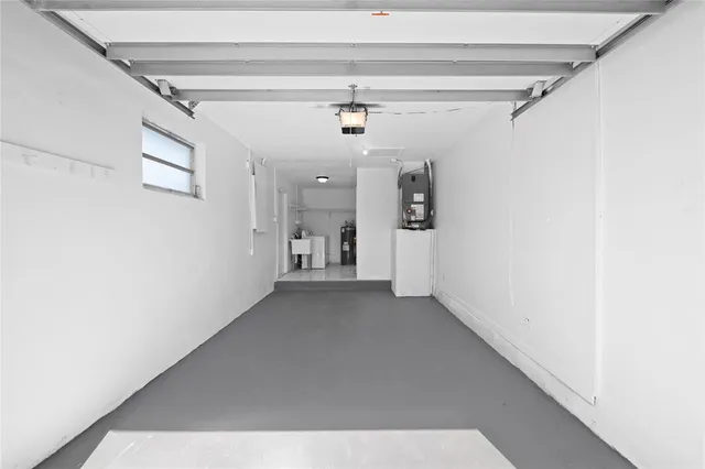 a utility room with cabinets washer and dryer