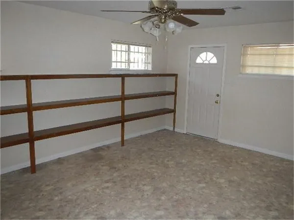 a view of empty room with windows